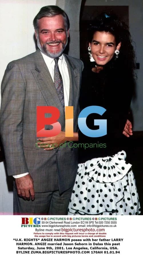 Angie Harmon poses with father Larry