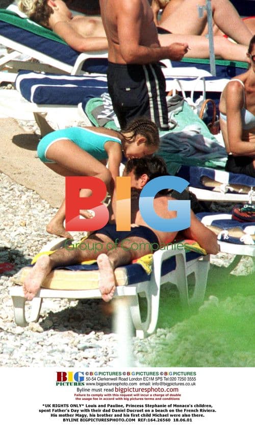 Louis and Pauline with dad Daniel Ducruet on beach