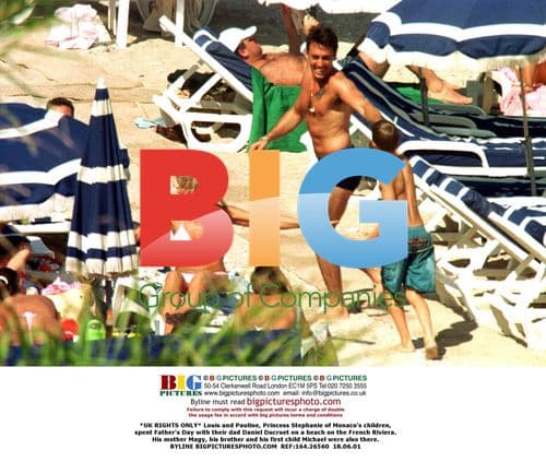 Louis and Pauline with dad Daniel Ducruet on beach