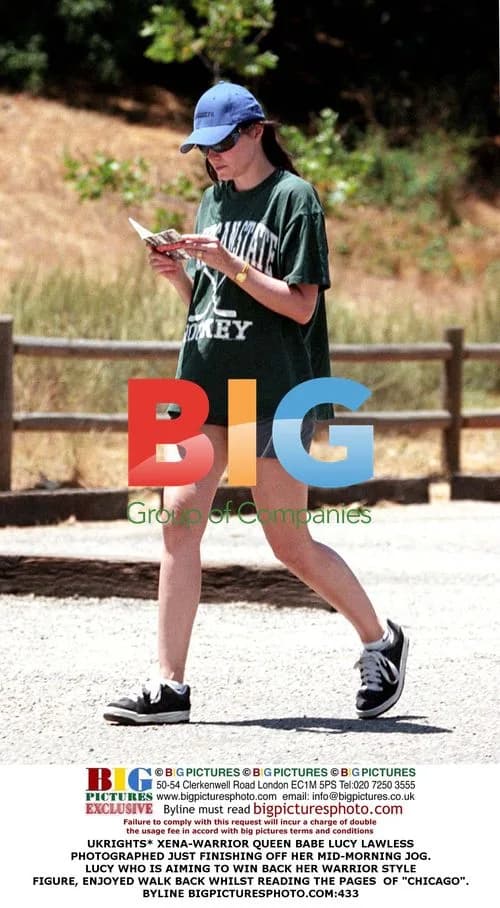 Lucy Lawless Jogging in Green Tee