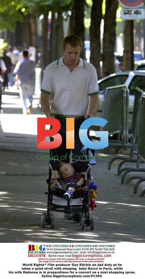 Guy Ritchie takes walk with baby Rocco in Paris