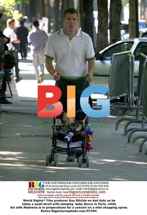 Guy Ritchie takes stroll with baby Rocco in Paris