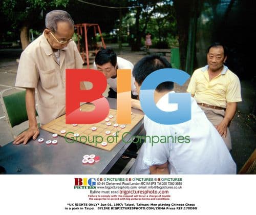 Men play Chinese Chess in Taipei park