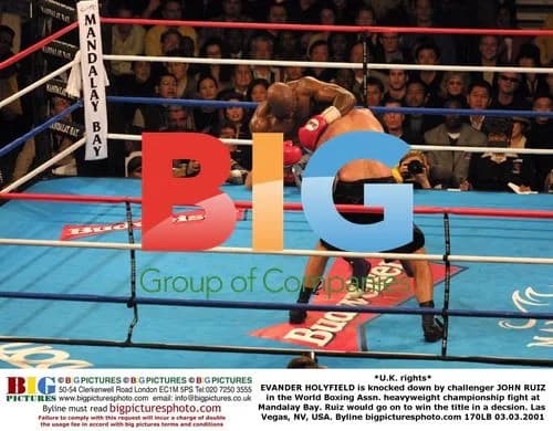Holyfield knocked down by Ruiz in heavyweight title fight