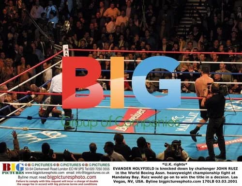 Holyfield knocked down by Ruiz