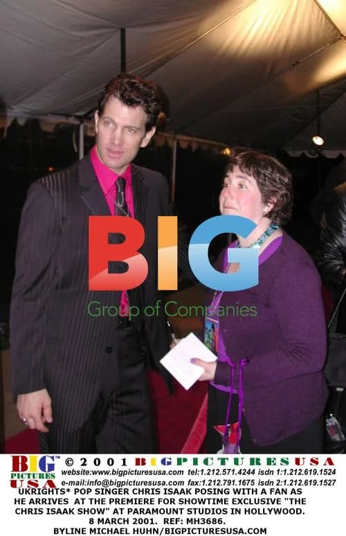 Chris Isaak Poses with Fan at TV Premiere