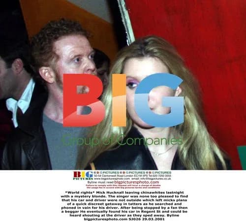 Mick Hucknall leaves club with mystery woman