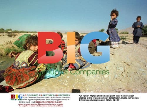 Afghan children wash clothes at Balochistan refugee camp