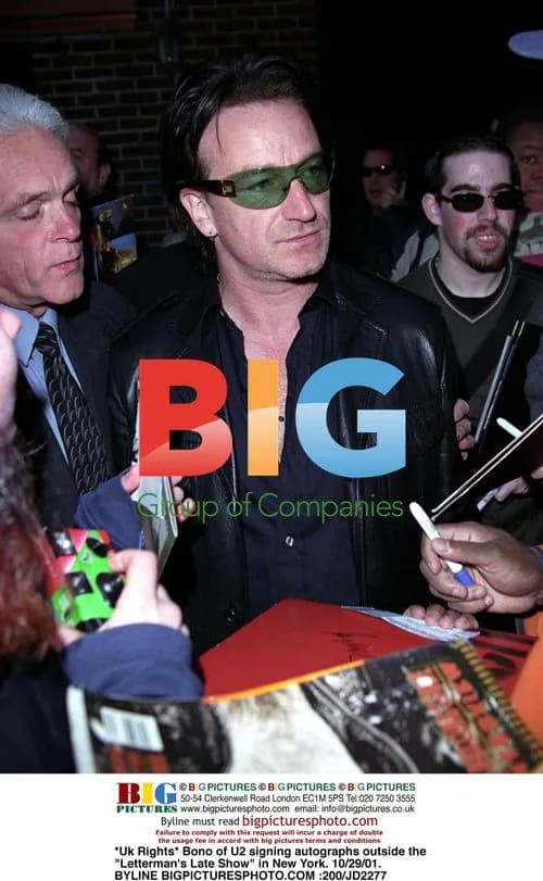 Bono of U2 signing autographs in New York