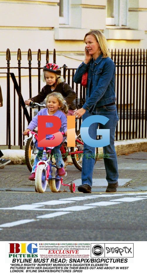ELIZABETH MURDOCH AND DAUGHTERS BIKE IN LONDON