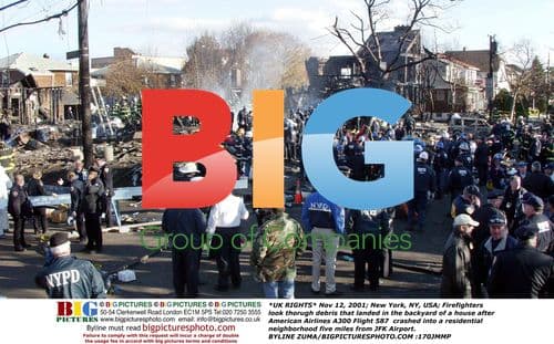 Firefighters search debris after plane crash