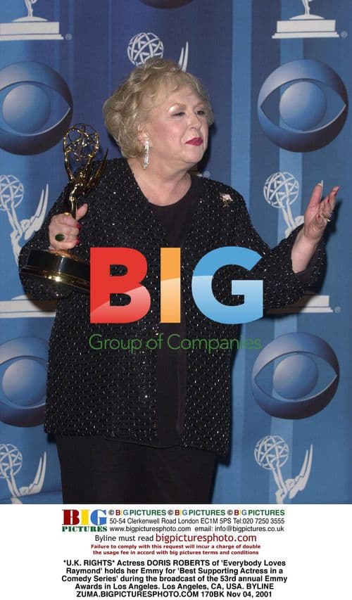 Doris Roberts Holds Emmy