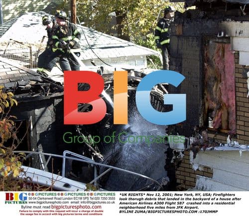 Firefighters Look Through Crash Debris