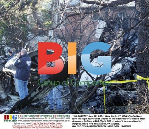 Firefighters Examine Plane Debris in Backyard