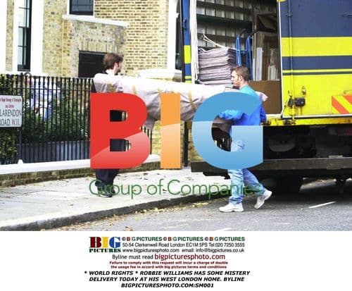 Robbie Williams Has Delivery at London Home