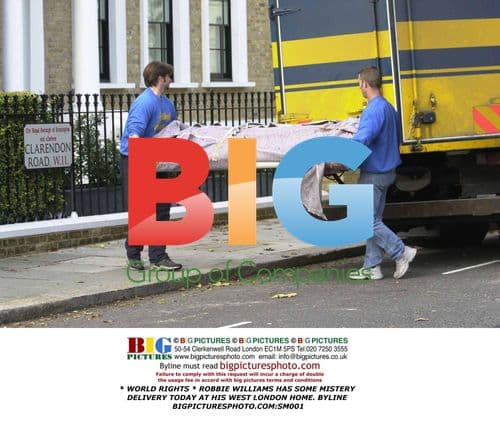 Robbie Williams Receives Mystery Delivery