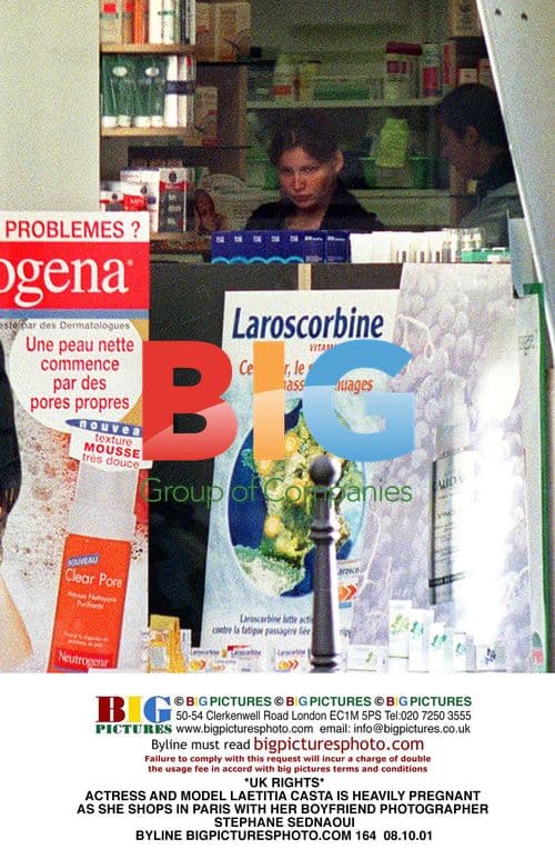 Pregnant Laetitia Casta shops in Paris with boyfriend