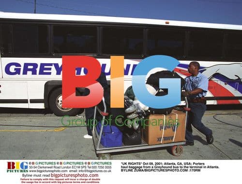 Porters hauling Greyhound bus baggage in Atlanta