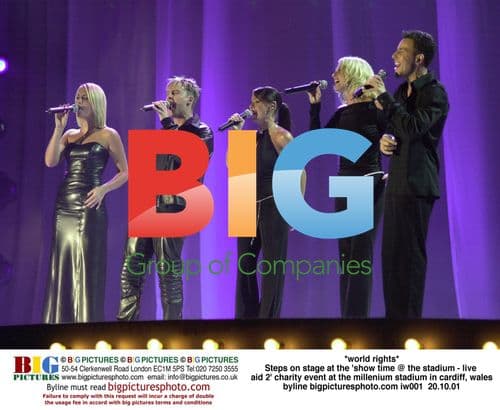 Steps on stage at 'Live Aid 2' in Cardiff