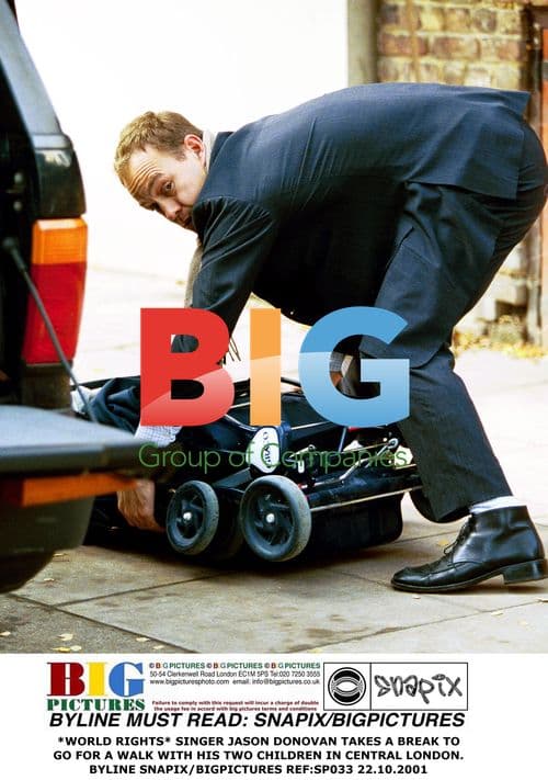 Jason Donovan takes a walk with kids in London