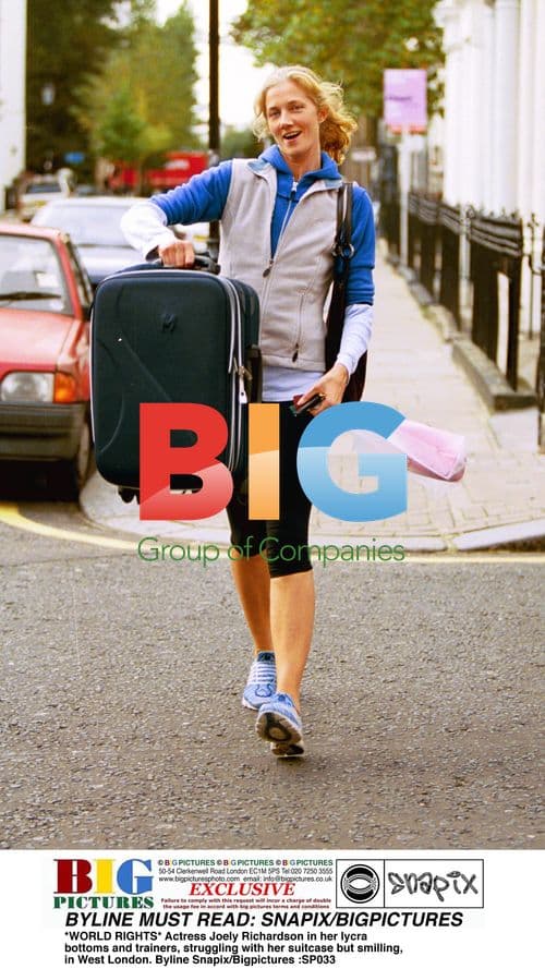 Joely Richardson struggles with suitcase in London