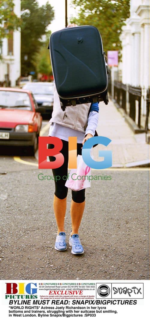 Joely Richardson Struggles With Suitcase in London