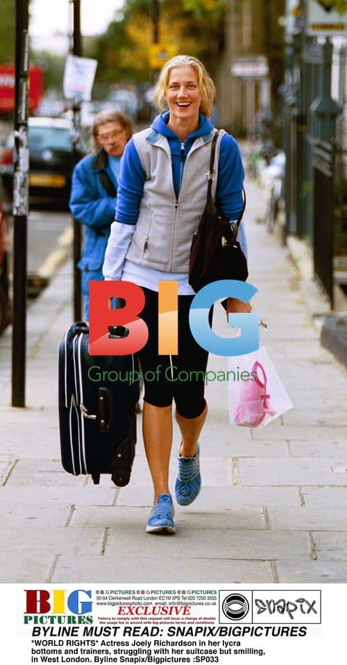 Joely Richardson with suitcase in West London