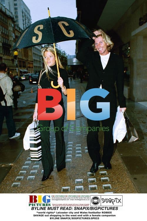 Robbie Savage out shopping with female companion