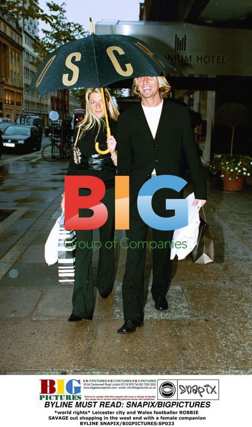 Robbie Savage shopping with companion