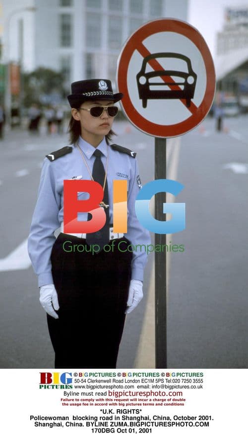 Policewoman blocking road in Shanghai, 2001