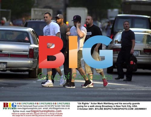 Mark Wahlberg and security guards walking in NYC