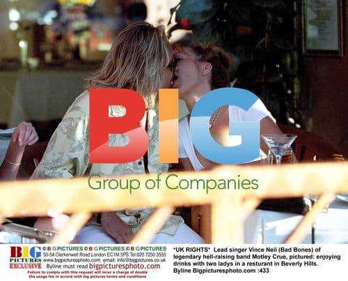 Vince Neil of Motley Crue Enjoying Drinks With Women