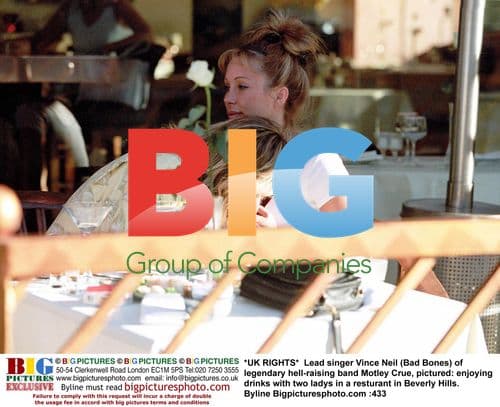 Motley Crue's Vince Neil Enjoying Drinks with Two Women