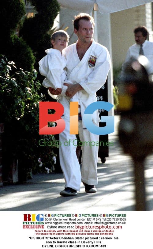 Christian Slater carrying son to Karate class
