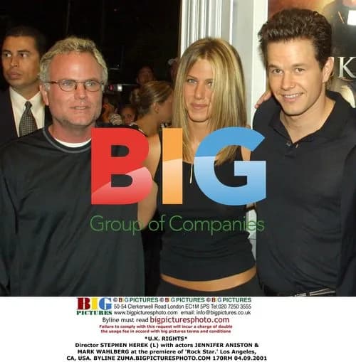 Director STEPHEN HEREK with ANISTON & WAHLBERG at 'Rock Star' premiere