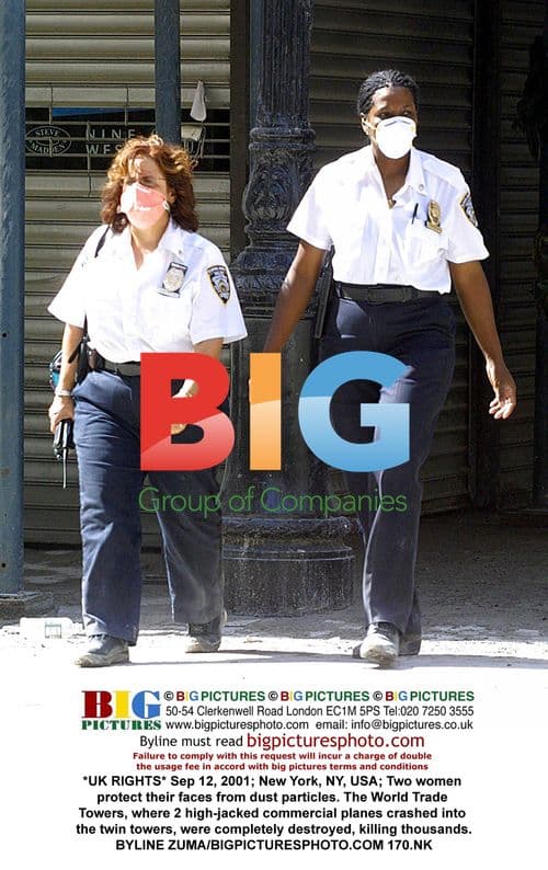 Women protect faces from debris after 9/11 attacks