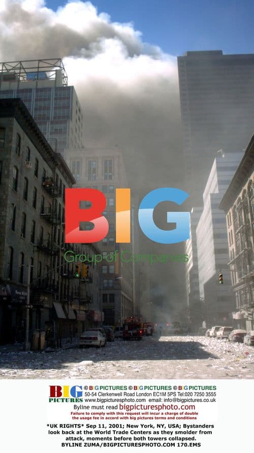 Bystanders watch WTC towers after 2001 attack