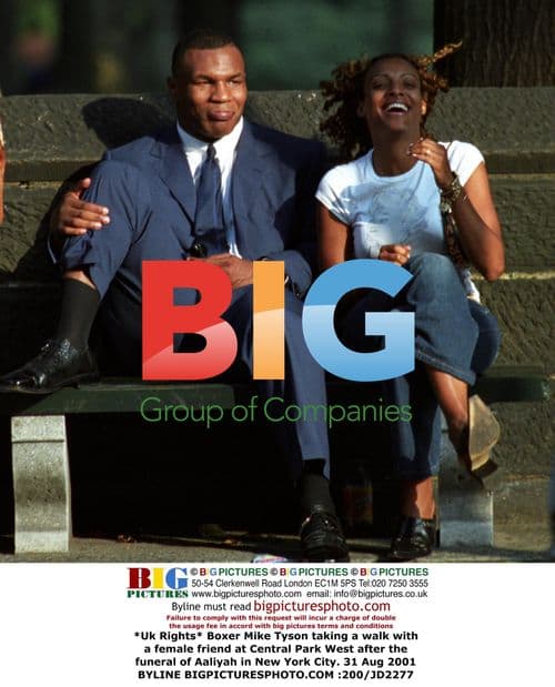 Mike Tyson takes walk with friend after Aaliyah funeral