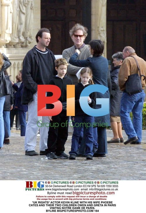 Kevin Kline with family at Notre Dame in Paris