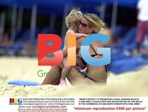 Ulrika Jonsson Cuddles Daughter Bo on Caribbean Beach