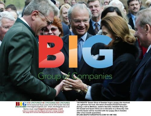 Queen Silvia of Sweden with Puppy Gift