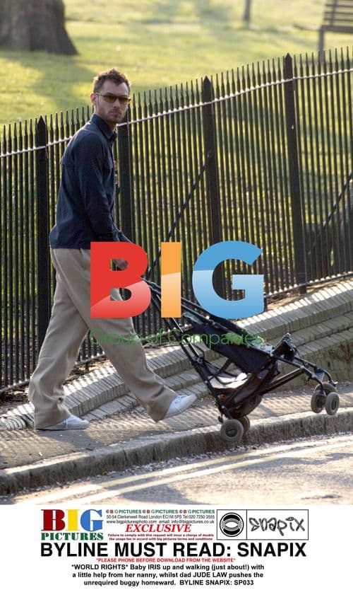 Jude Law walking with baby Iris