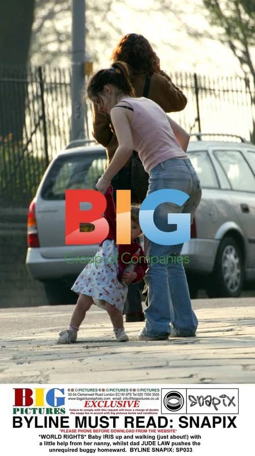 Jude Law with baby Iris on a stroll