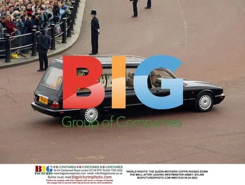 The Queen Mother's coffin passes down The Mall