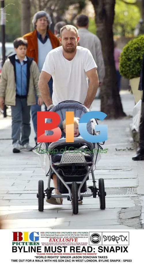 Jason Donovan Takes Walk with Son Zac