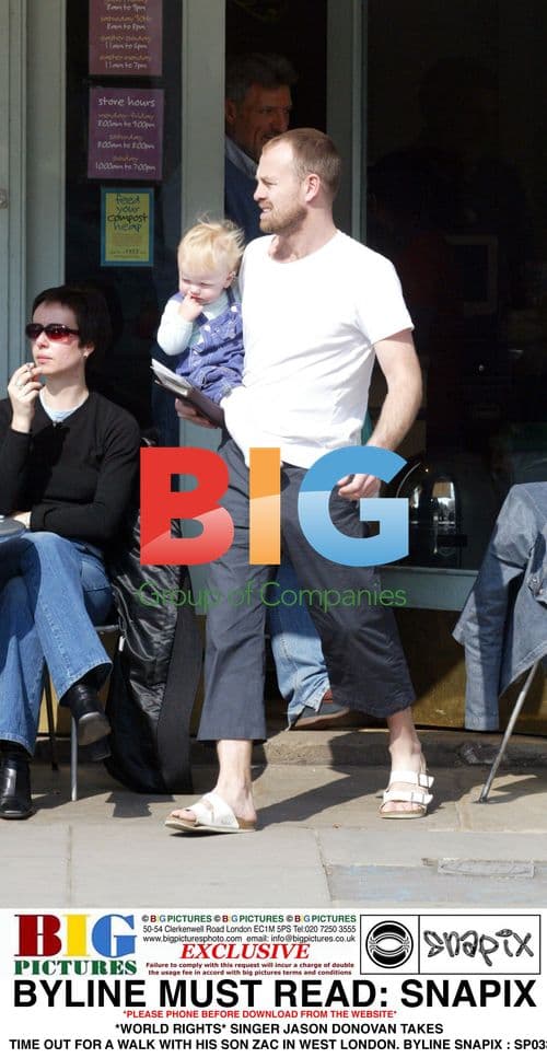 Jason Donovan Takes Walk with Son Zac in London