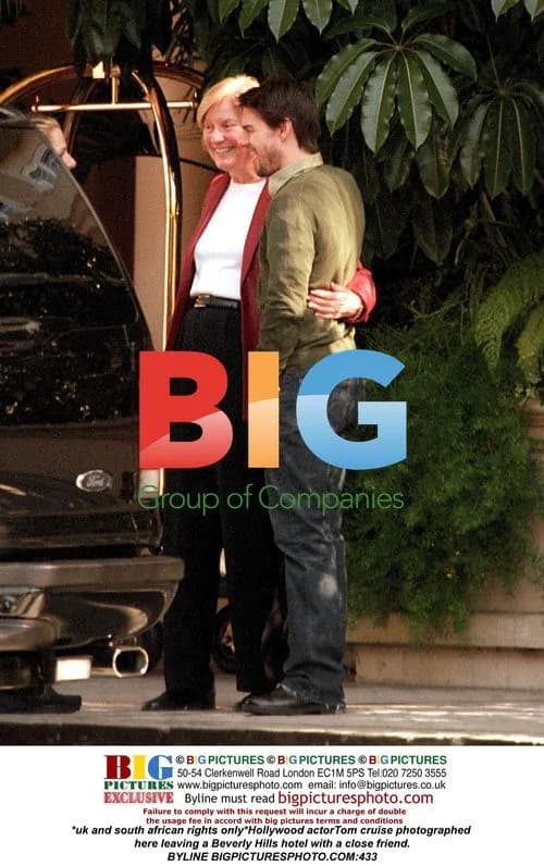 Tom Cruise leaves Beverly Hills hotel with friend