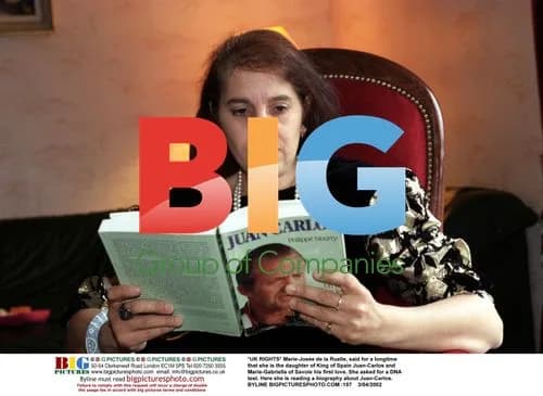 Marie-Jose de la Ruelle reading biography of King Juan-Carlos