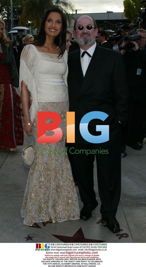 Salman Rushdie and date arrive at Vanity Fair Oscars party