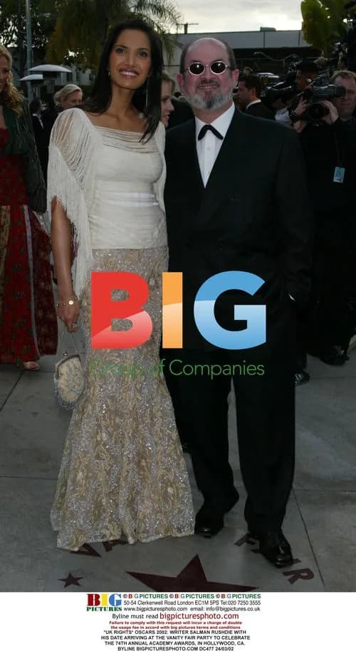 Salman Rushdie and date arrive at Vanity Fair Oscars party